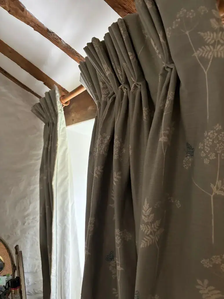 Sage green curtains in a cottage interior