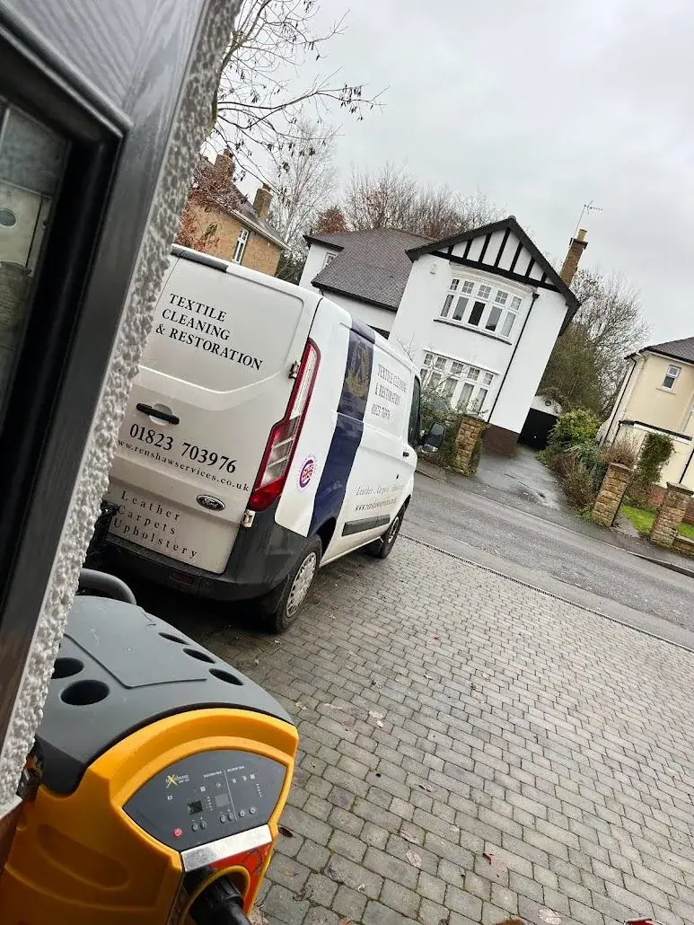 Renshaw Services branded van outside a country property