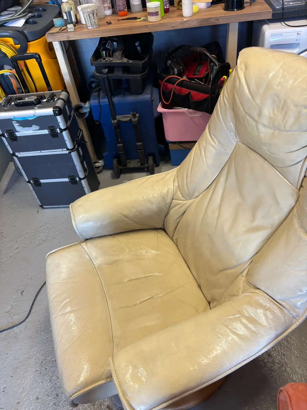 Cream leather armchair restoration in the workshop