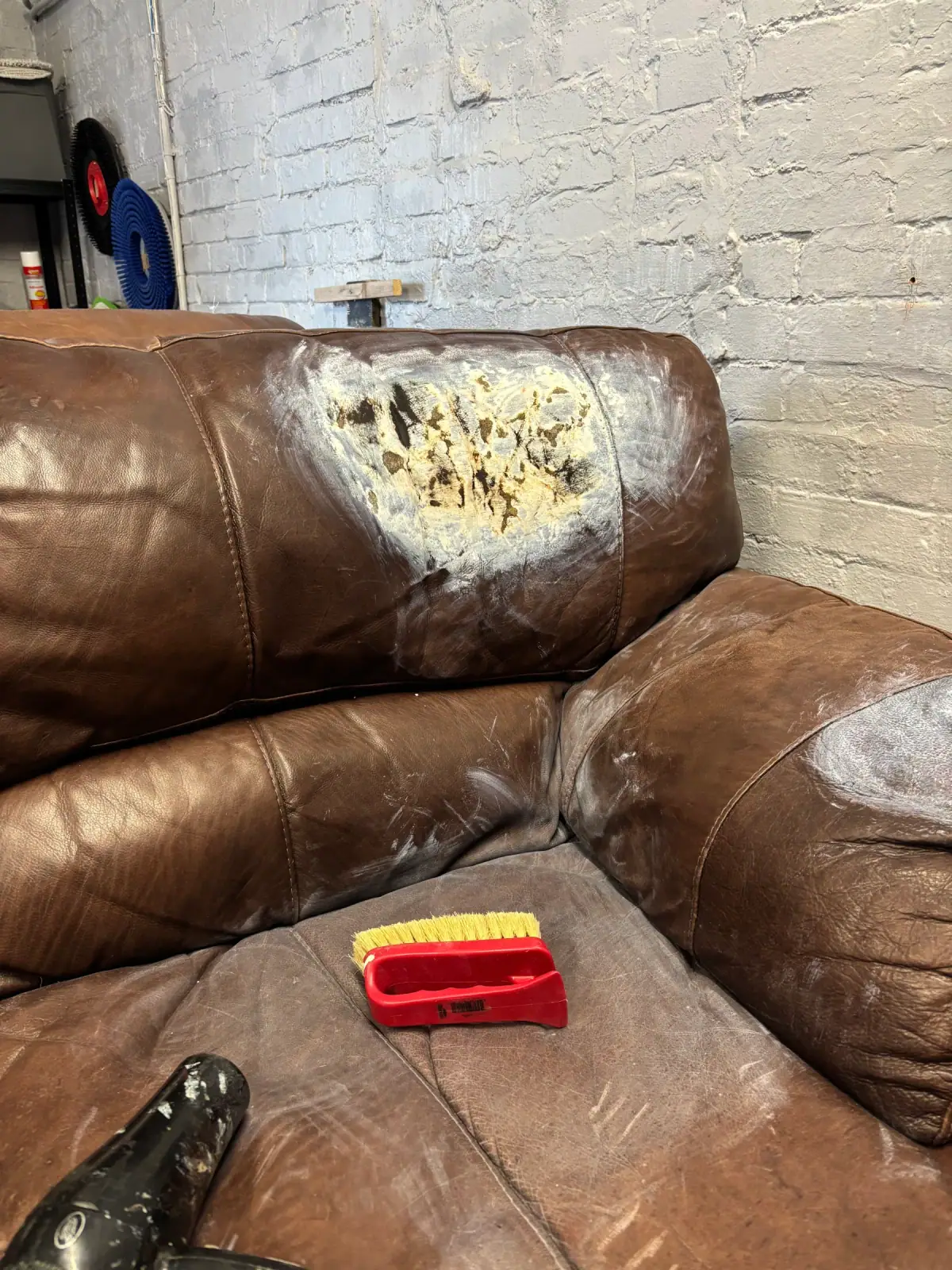 Leather sofa backrest repair in progress